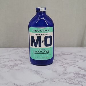 HALEY'S MO Antique Blue Glass Bottle with paper label and Metal lid